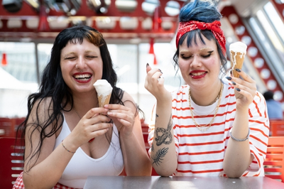Two young women sharing a candid outdoor portrait in Seattle