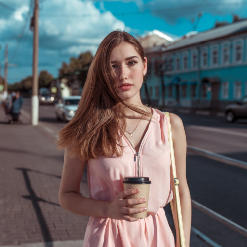 Woman photographed on a colorful city street